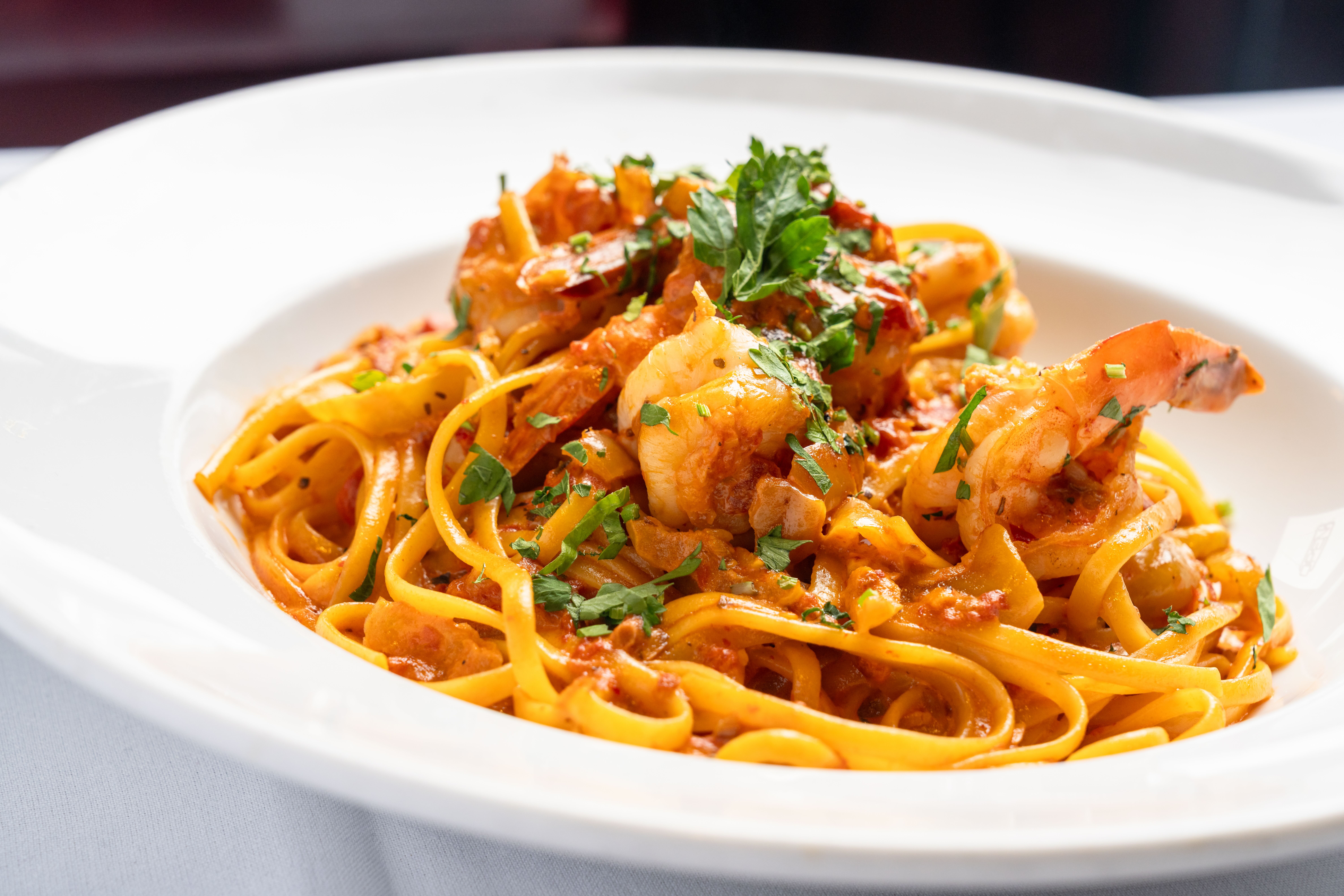 Classic Italian pasta dish with cream sauce and seafood at Chef Tony's.
